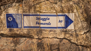 Sicily - Sunny impressions of the Aeolian Islands, also known as Aeolian Islands or Isole Eolie: Lipari, Stromboli, Salina, Vulcano, Panarea, Filicudi and Alicudi. Signpost to Spiaggia Fumarole, Panarea. Sicily - Sunny impressions of the Aeolian Islands, also known as Aeolian Islands or Isole Eolie: Lipari, Stromboli, Salina, Vulcano, Panarea, Filicudi and Alicudi. Signpost to Spiaggia Fumarole, Panarea.